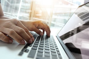 Double exposure of business man hand working on blank screen laptop computer on wooden desk as concept-1